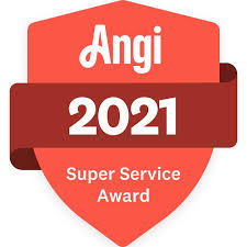 A red shield-shaped badge displays the text “Angi 2021 Super Service Award” in white, highlighting excellence in services like roofing. A diagonal red ribbon overlays the badge with "2021" in larger font.